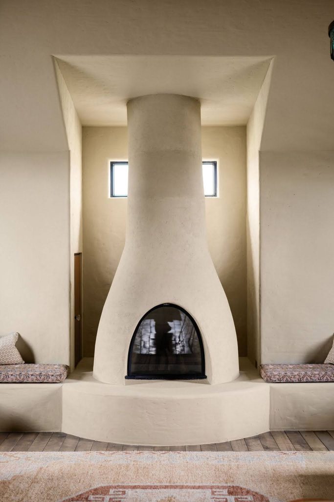 Custom plaster fireplace with Southwestern architectural influence