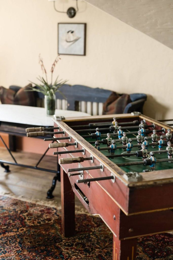 Personalized interior design featuring a vintage foosball table
