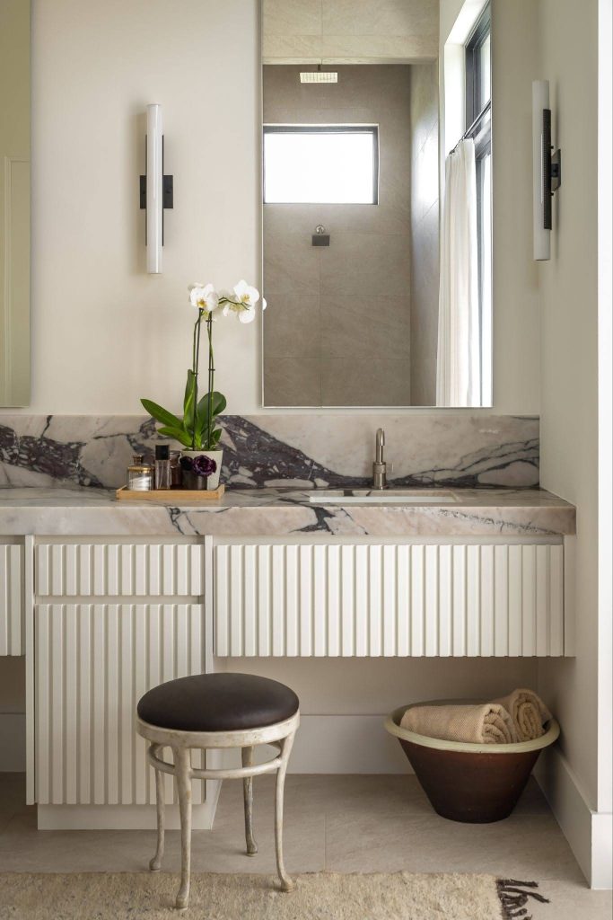 Modern bathroom featuring architectural millwork and natural materials