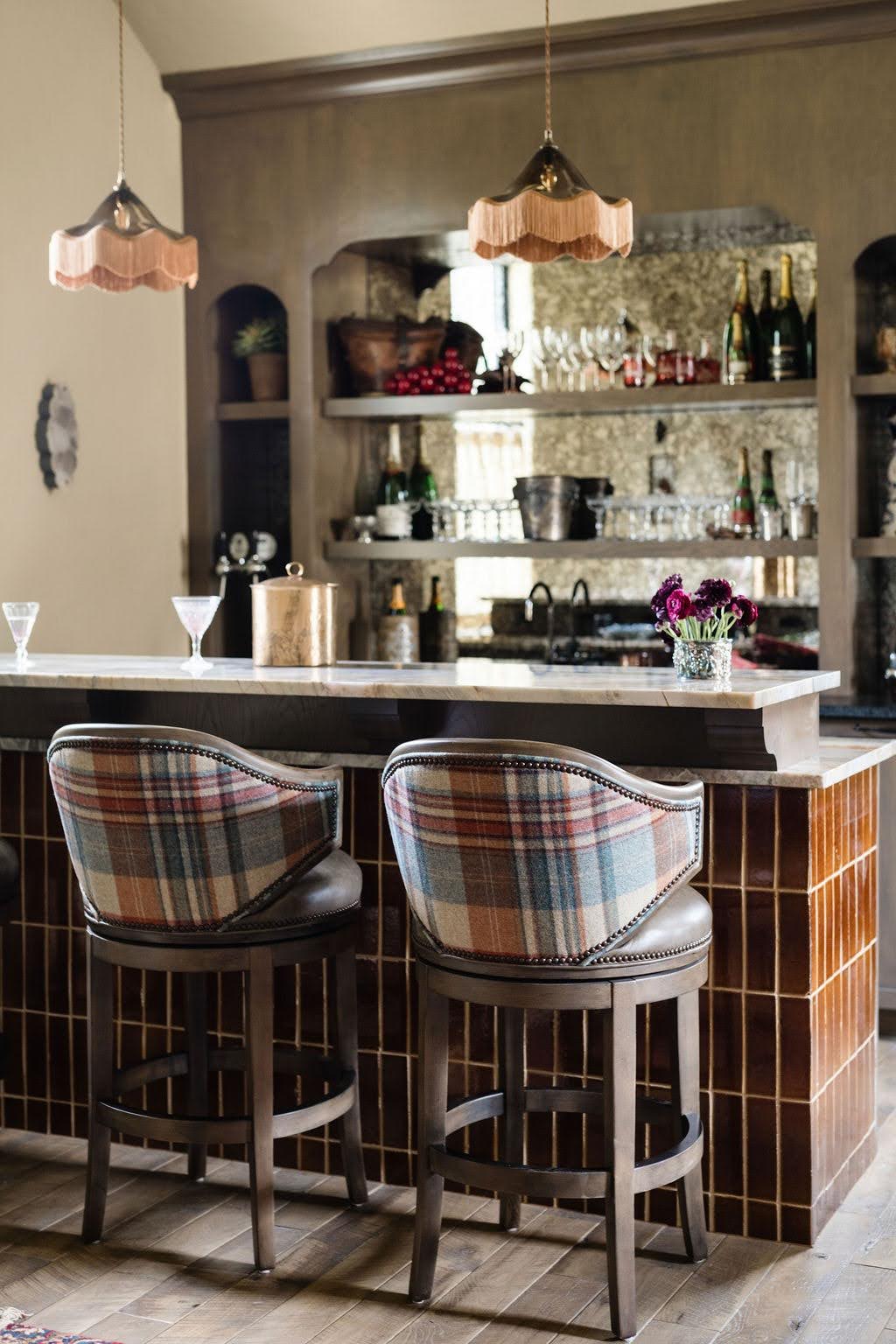 Custom residential bar with curated furnishings and architectural details