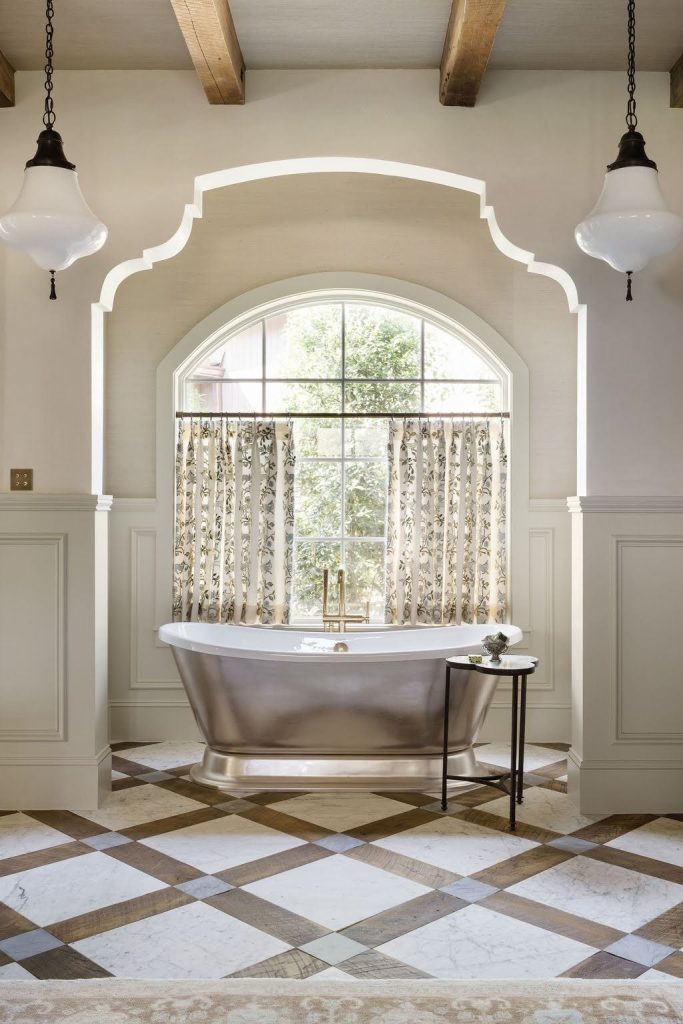 Luxury bathroom with mixed material flooring and architectural details