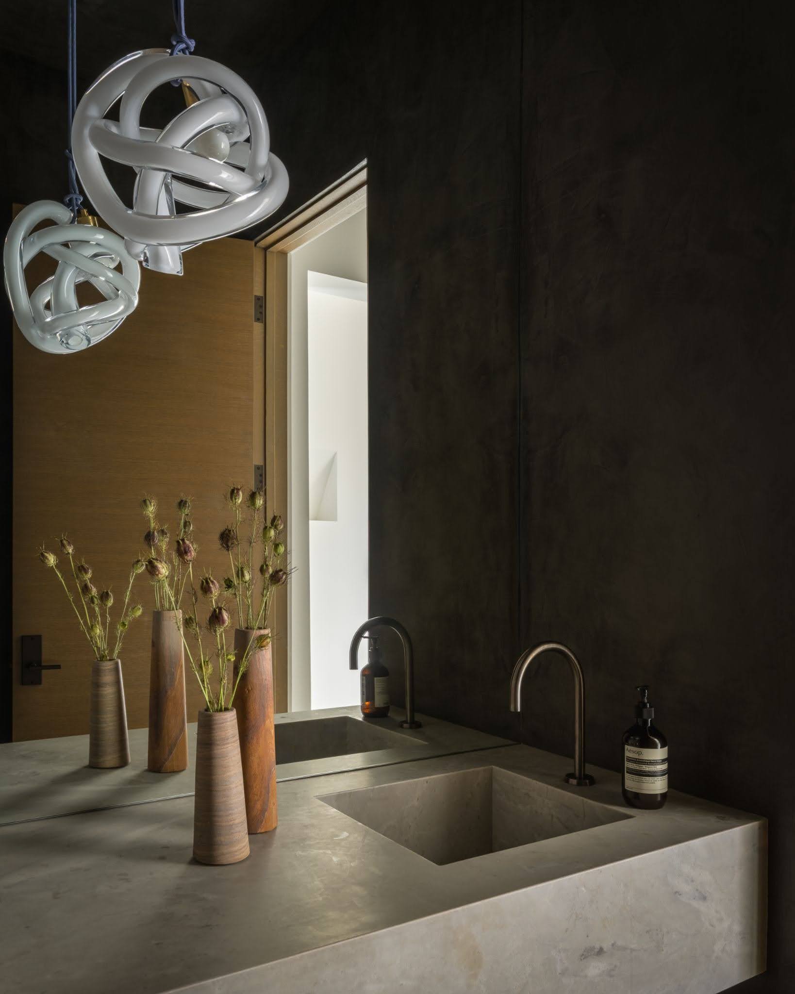 Contemporary powder room with full height mirror and dark textured walls