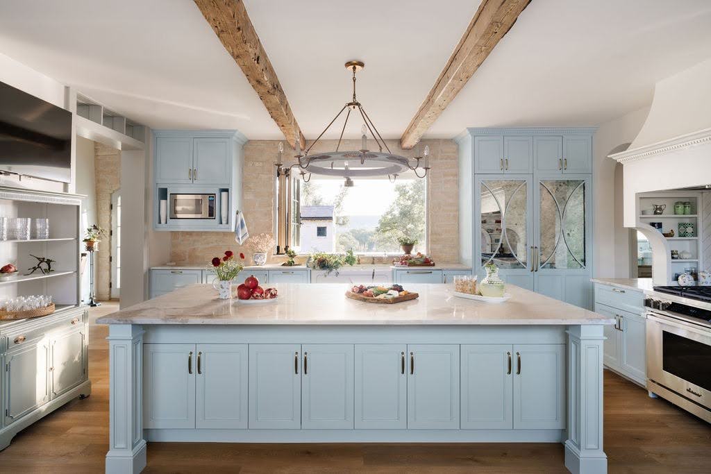 Building for the Way You Entertain: How Lifestyle Shapes a Custom Home Luxury custom home kitchen with spacious island, blue cabinetry, and exposed wood ceiling beams Luxury custom home kitchen with spacious island, blue cabinetry, and exposed wood ceiling beams